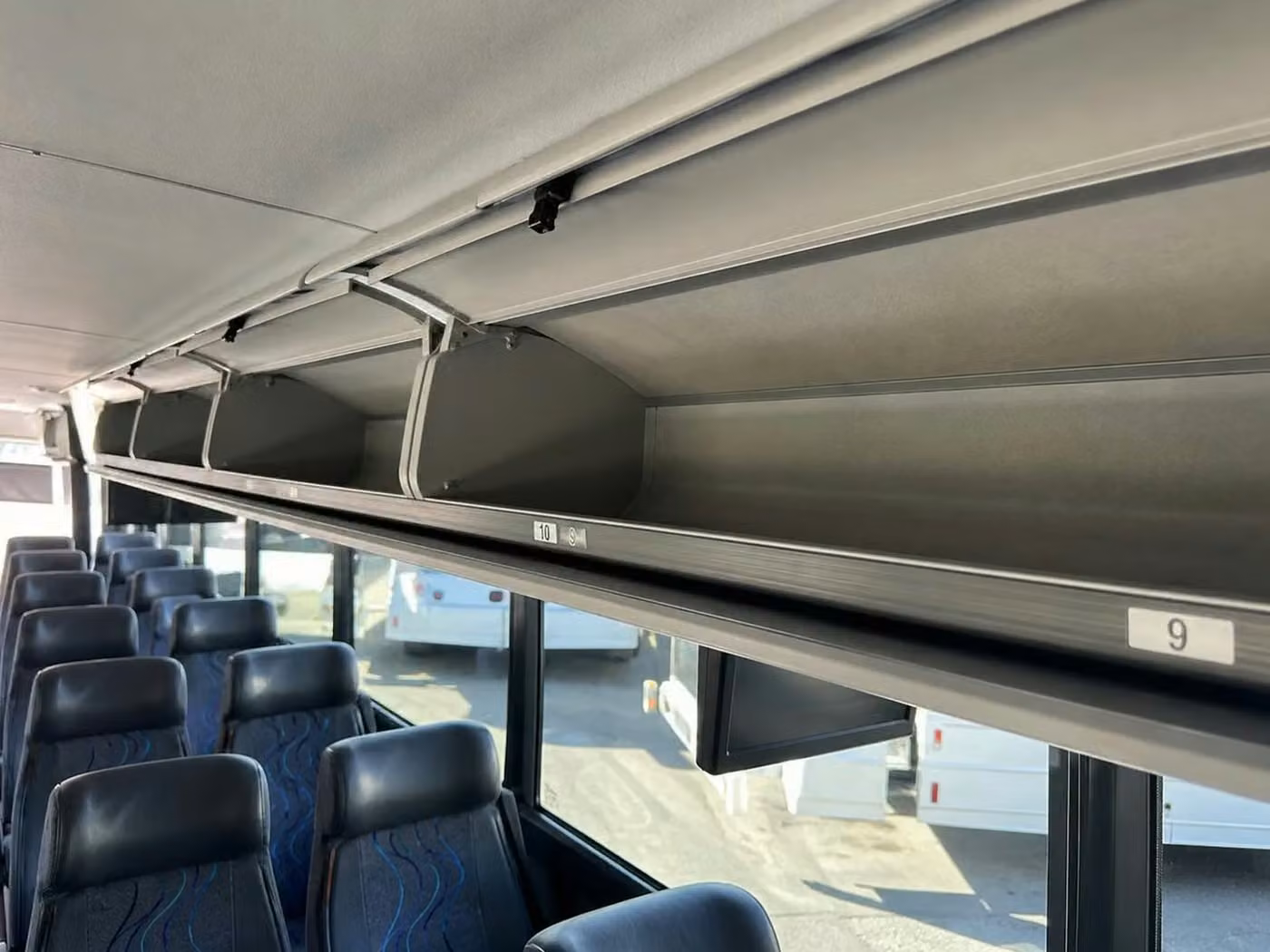 torrington 56 passenger charter bus overhead storage